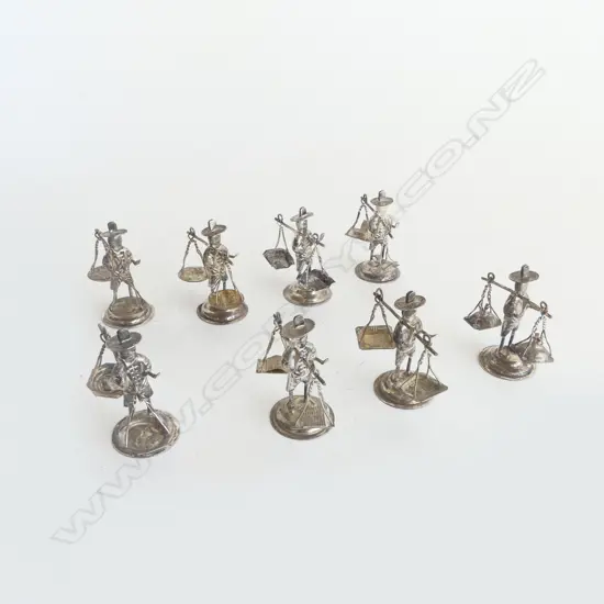 8 SILVER? MODEL MEN CARRYING LOADS WITH POLES 