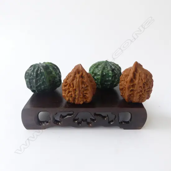 4 CARVED 'WALNUTS' ON STAND W.140mm