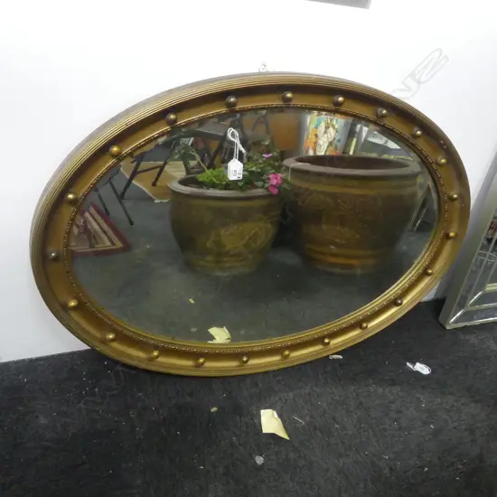 EARLY 20THC GILTWOOD OVAL MIRROR W ball detail to frame. Bevelled edge 950 x 645mm