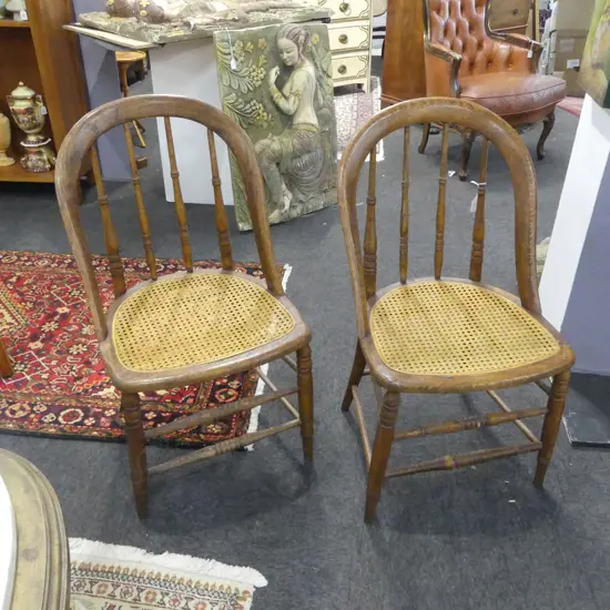 2 OAK BOW/SPINDLE BACK WICKER CHAIRS 