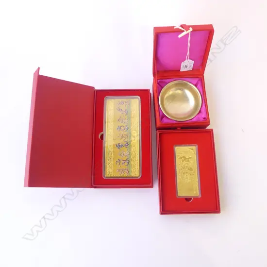 3 ORIENTAL ITEMS IN RED BOXES; 2 GOLD TOKENS, SILVER METAL TEA BOWL 85mm dia