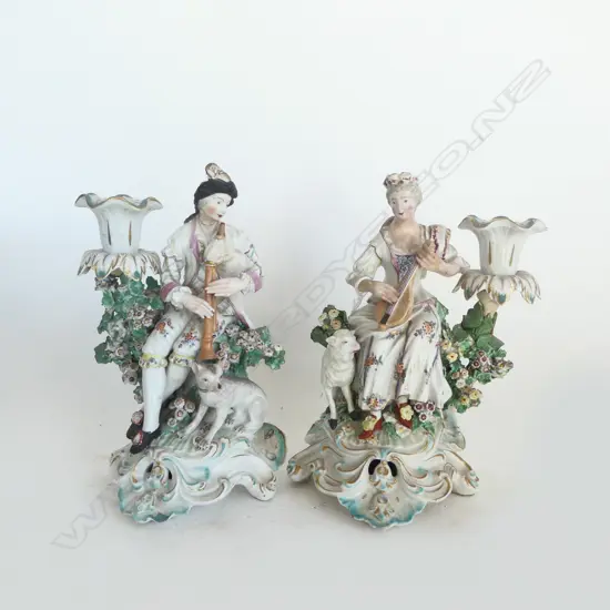 PR 18thC CHELSEA-DERBY FIGURAL CANDLESTICKS; GENT w. BAGPIPES, LADY w. LUTE H.220mm, REPAIRS