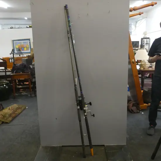 TWO SURFCASTING RODS WITH DAIWA REELS