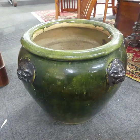 LARGE TERRACOTTA GREEN GLAZED POT EMBLESHED WITH 4 LION HEADS HEIGHT 500mm