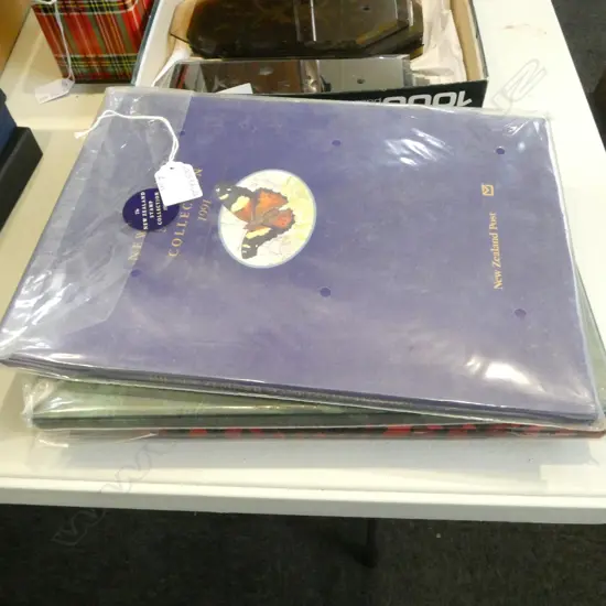 4 UNWRAPPED CASED 'THE NZ STAMP COLLECTION' ALBUM, YEARS; 1991, 92, 93 & 94