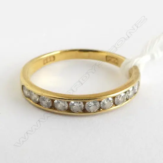 14ct GOLD BAND RING channel set with 10 BRILLIANT CUT DIAMONDS 2gms SIZE N