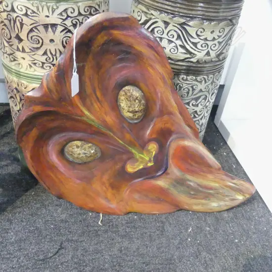 CARVED PAINTED WALL HANGING OF MAHUIKA WITH INLAID PAUA EYES SIGNED 'MAHUIKA - GODDESS OF FIRE' H.500mm