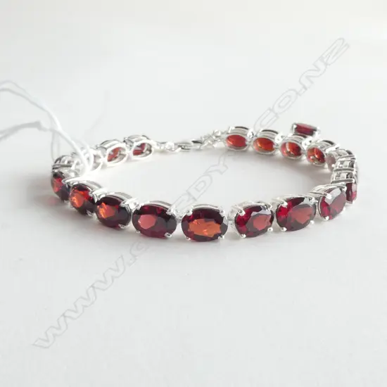 SILVER SET GARNET TENNIS BRACELET (OVAL)