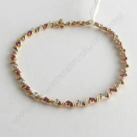 9CT GOLD DIAMOND AND RUBY TENNIS BRACELET 5.68gm