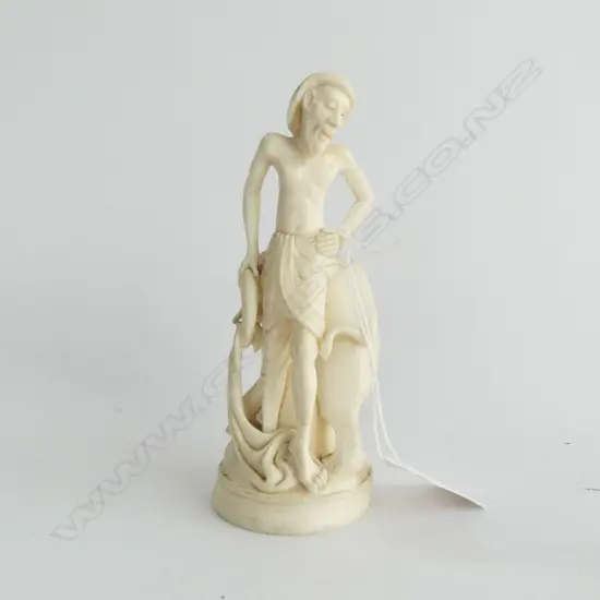 OLD INDIAN SOLID & well CARVED IVORY FIGURE GROUP of a man with his elephant curved behind him . Circular base H.140mm
