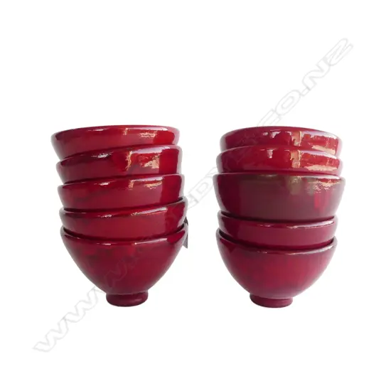KEUM SUN LEE 10 PORCELAIN RED GLAZED FOOTED BOWLS. H.70mm