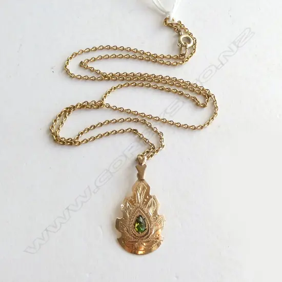 **RTV**  9CT ROSE GOLD & PERIDOT PENDANT ON GOLD TONE CHAIN. 1.82gm