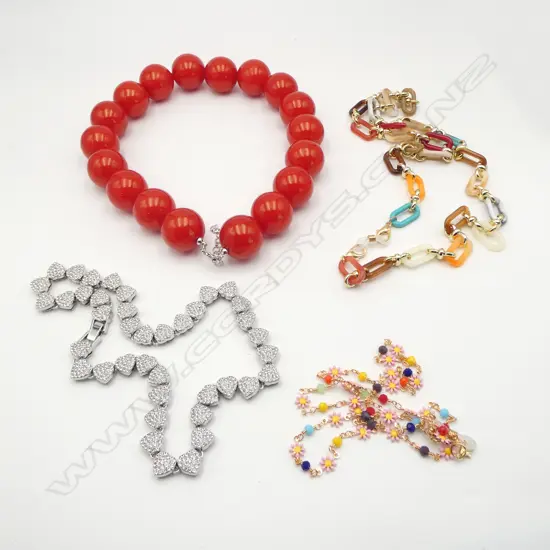 FOUR COSTUME JEWELLERY NECKLACES