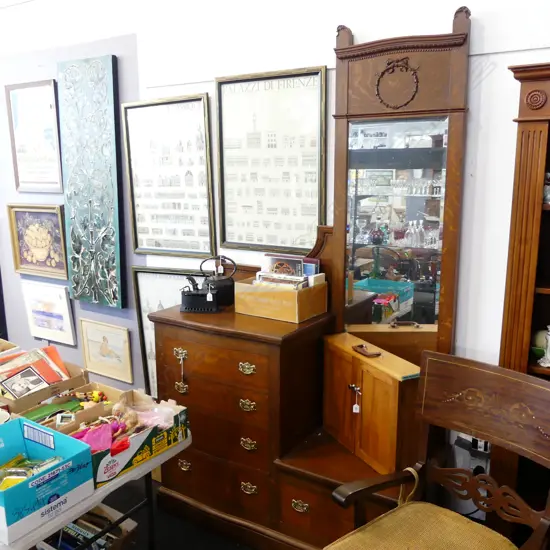 EDWARDIAN OAK, MIRROR-BACKED, SERPINTINE FRONT CHEST OF DRAWERS. H.2280, L.1310mm