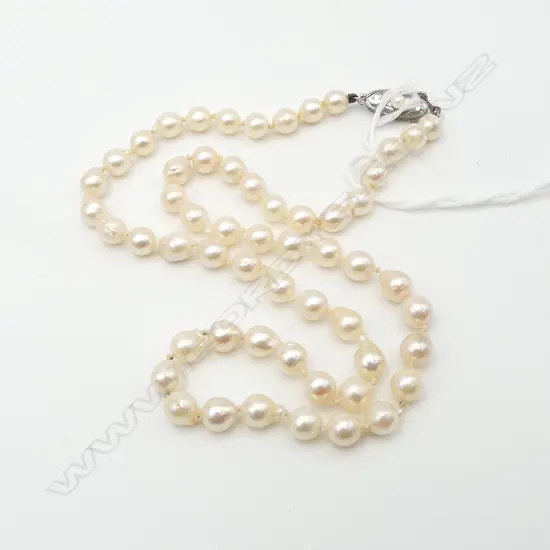 SINGLE STRAND OF SEMI-BAROQUE PEARLS