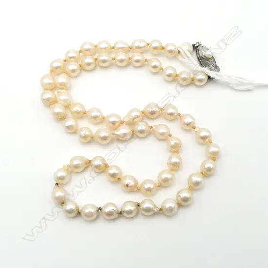 SINGLE STRAND OF SEMI-BAROQUE PEARLS