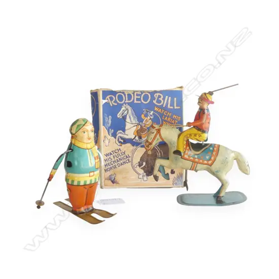 2 VINTAGE WIND UP TOYS, GERMAN SKIIER, ENGLISH 'RODEO BILL' w. ORIG. BOX H.150mm