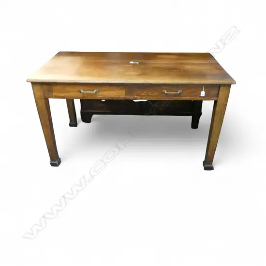 1920'S OAK LIBRARY TABLE square section legs. 2 drawers w brass handles. Gd oak graining. 1365 x 750 x 765mm.