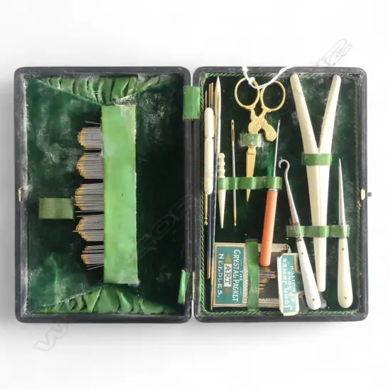 EDWARDIAN LEATHER CASED SEWING SET: various bone implements + scissors + needles etc