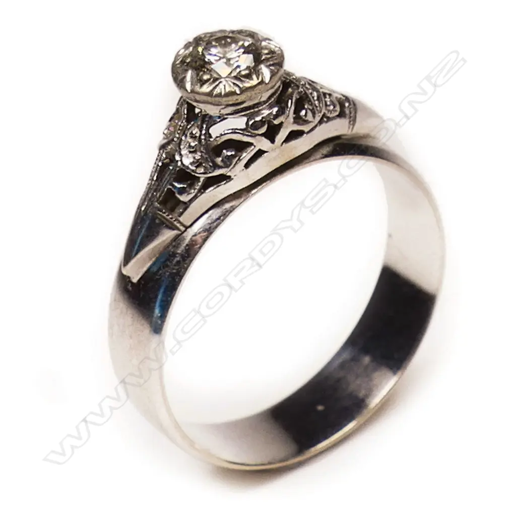 9CT WHITE GOLD OLD CUT DIAMOND SOLITAIRE RING # A 9ct gold and diamond solitaire ring,  a 0.20ct early brilliant cut dia Image 1++