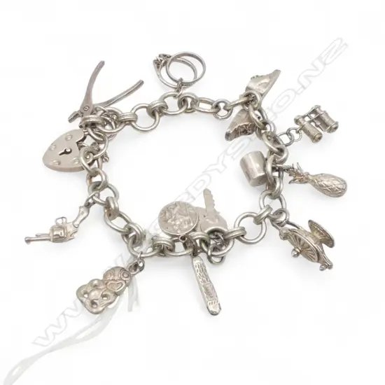 SILVER CHARM BRACELET tiki + pliers + other charms 47gms