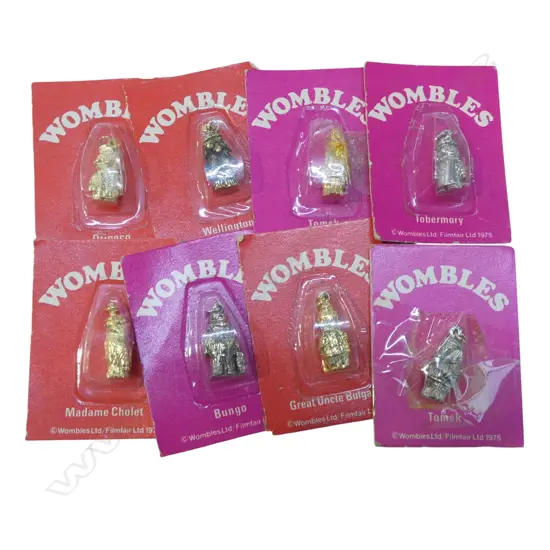 8 ORIGINAL 'WOMBLES' CHARMS in original packaging w card backing. 1 sellotaped closed 