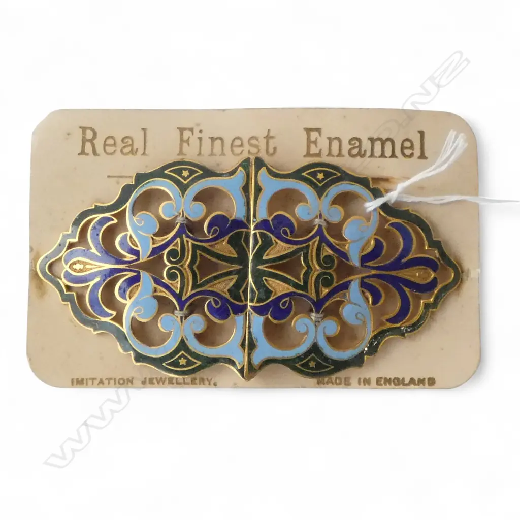 An Edwardian green & blue scrolling belt buckle on original card backing. New old stock. L.120mm Image 1++