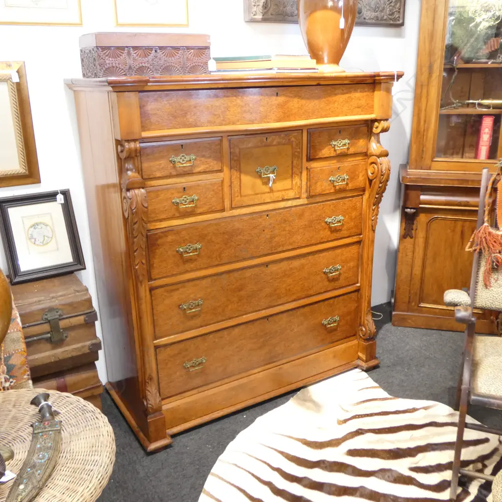 NINE DRAWER MOTTLED KAURI SCOTCH CHEST  SERPENTINE TOP FRIEZE DRAWER CARVED COLUMNS1205x570x1355mm feet need reattaching Image 1++