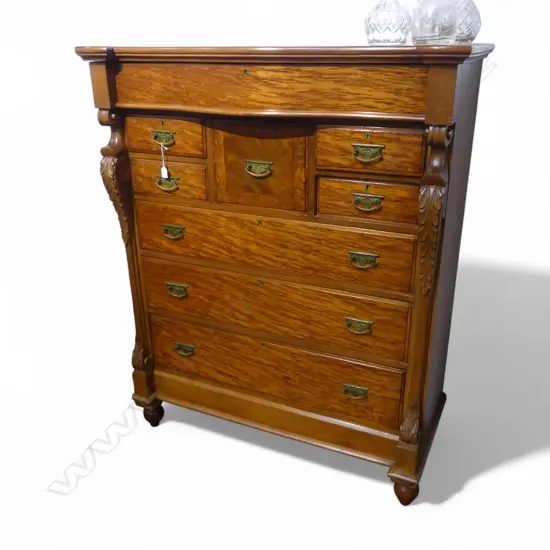 NINE DRAWER MOTTLED KAURI SERPENTINE TOP SCOTCH CHEST WITH FRIEZE DRAWER & CARVED COLUMNS  1210x570x1510mm