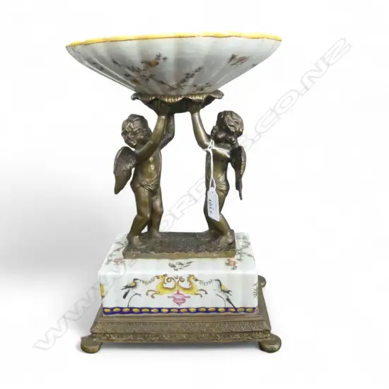 A WONG LEE CENTREPIECE - DISH SUPPORTED BY TWO GILT CHERUBS 335mm (H)