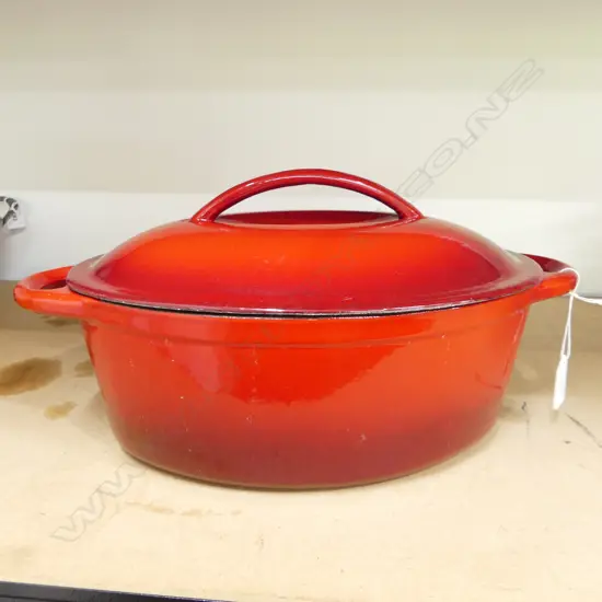 RED ENAMELLED CAST IRON OVAL LIDDED CASSEROLE W.370mm