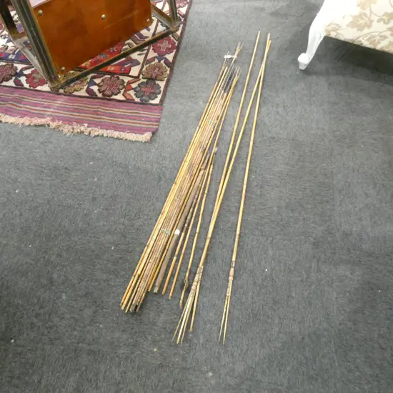 GROUP OF 12 + TRIBAL BAMBOO & OTHER SPEARS some stained & coloured carved detail