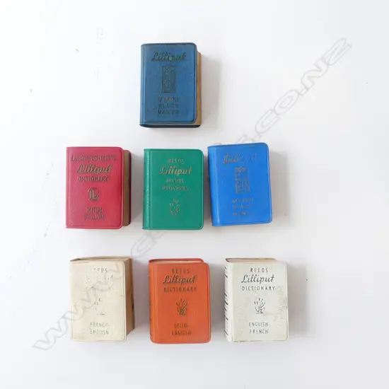 7 VINTAGE REED'S LILLIPUT MINIATURE BOOKS; 2 x MAORI PLACE NAMES, PROVERBS, 4 DICTIONARIES ENG/FRENCH/DUTCH/LATIN L.50mm