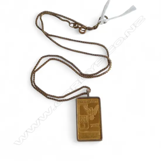 999CT GOLD 5gms INGOT IN 9CT GOLD MOUNT AND 9CT GOLD CHAIN 7.8gms total