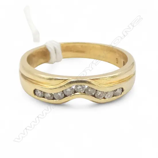 18CT Y/GOLD CHANNEL SET DIAMOND BAND 4.83gms SIZE N