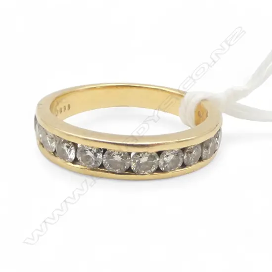 18CT GOLD CHANNEL SET DIAMOND BAND( approx.1.00ct total DIA Weight) 4.97gms SIZE O1/2