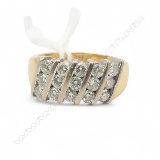 18CT GOLD AND CHANNEL SET DIAMOND RING 1.00ct total 8.84gms SIZE O