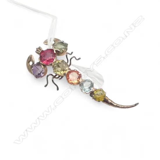 9ct gold scorpion brooch with semi precious stones 3.36gms
