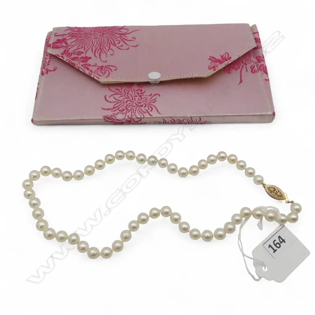a single strand of 53 Akoya cultured pearls (silver cream tone Image 1++