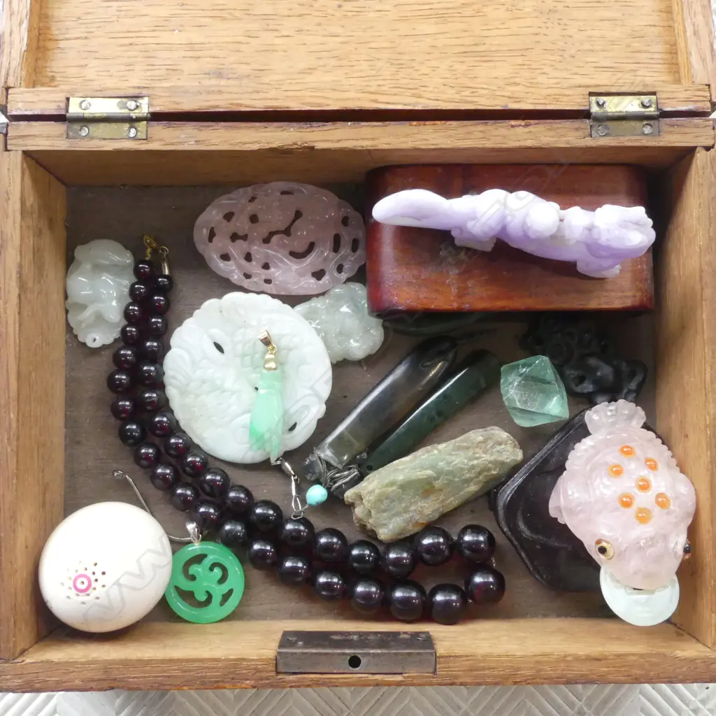 WOODEN JEWELLERY BOX W.215mm  ASST. CONTENTS ORIENTAL STONE CHARMS (0ne with 18ct top/pendent A/F to fingers) Image 1++
