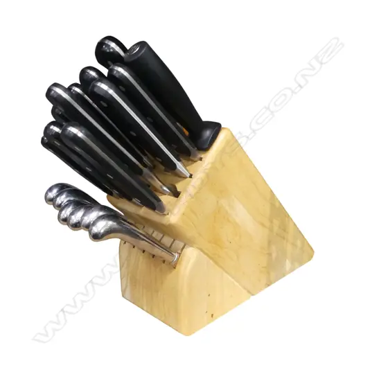 A SET OF WUSTHOF KITCHEN KNIVES IN WOODEN BLOCK INCLUDES, 9 KNIVES, SHARPENER, SERVING FORK AND SIX STEAK KNIVES  