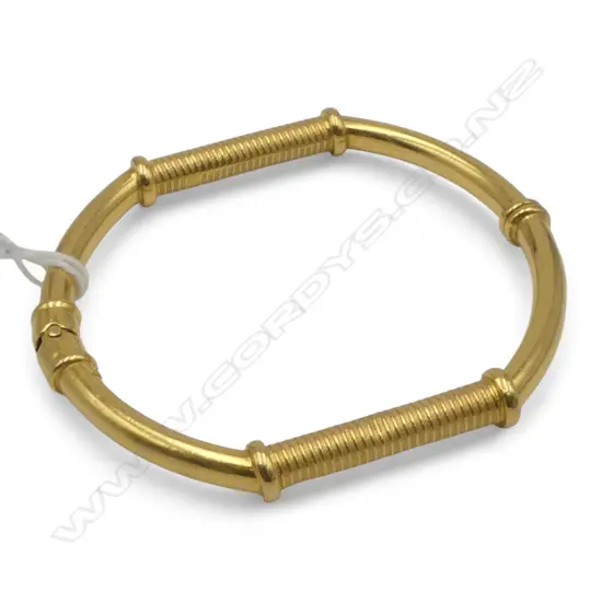 22CT GOLD BANGLE with small steel spring  21.92gms...