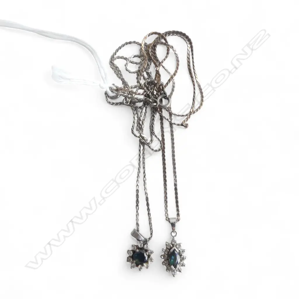 2 SAPHIRE & WHITE STONE PENDANTS ON SILVER CHAINS Image 1++
