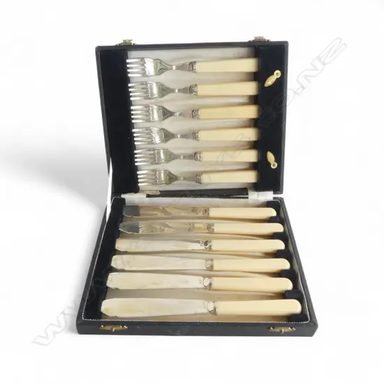 A BOXED SET OF SILVER PLATE FISH KNIVES AND FORKS