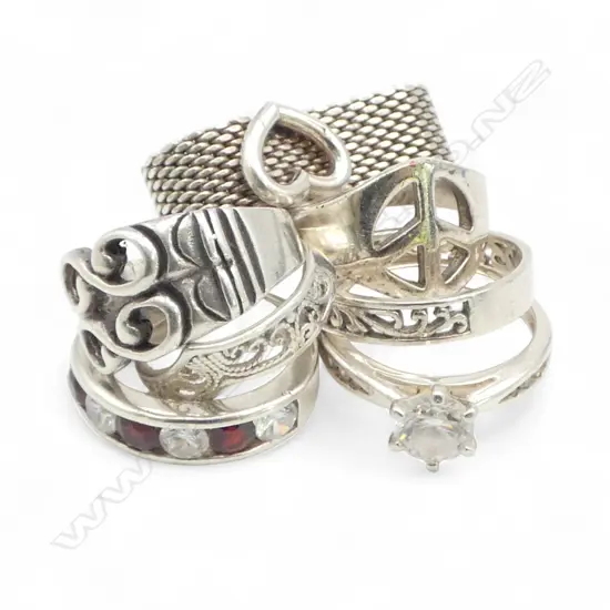 7 SILVER RINGS, TWO w CZs, 24.81gm