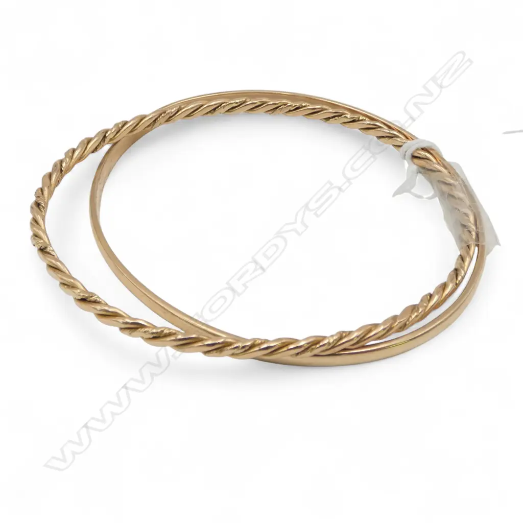 Two 18ct gold bangles: plain hoop & rope twist. 34gms. Image 1++