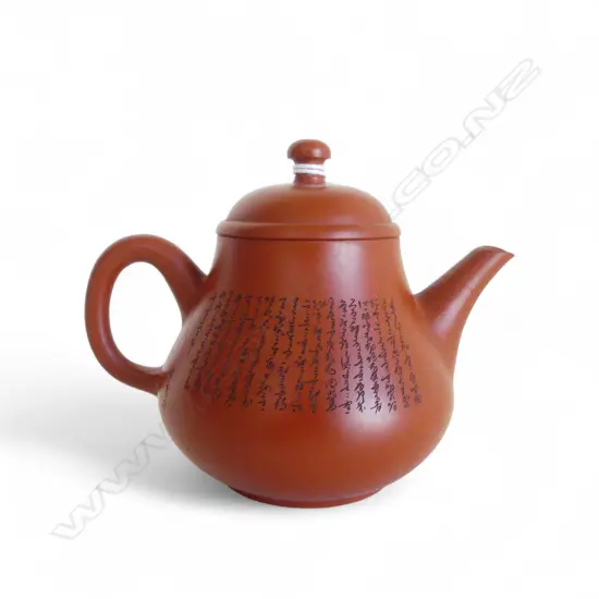 YIXING POTTERY SMALL TEAPOT with fine calligraphy. Faulted. Hair cracks. In tall box