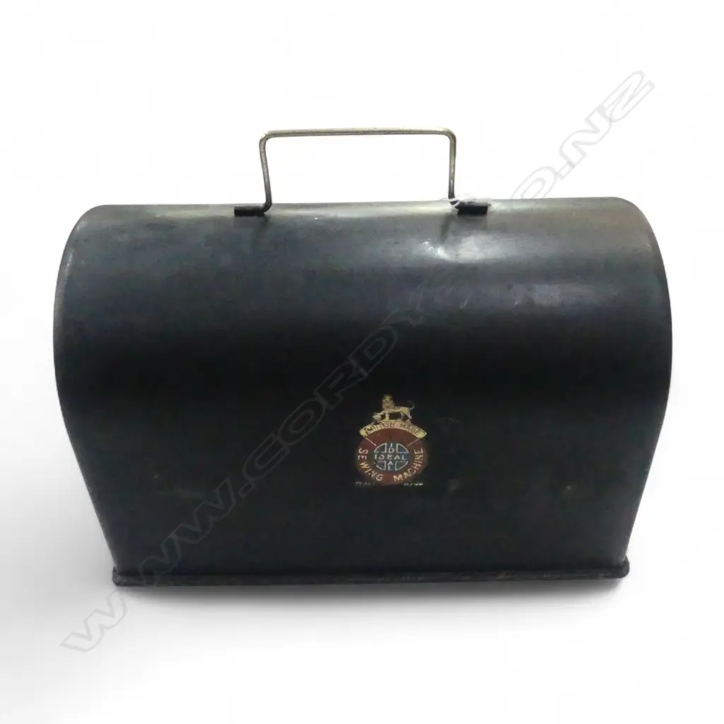 EARLY 20thC SMALL 'IDEAL SEWING MACHINE' chromed on oak base w black tin cover. Hand operated. L.255mm Image 1++