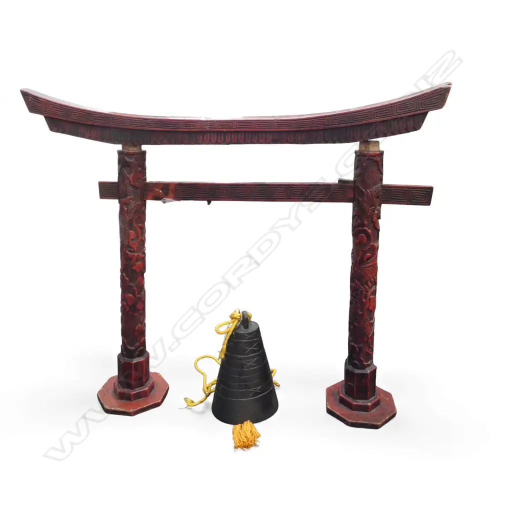 An early 20thC Chinese bronze bell on red lacquer stand -  the temple arch form stand with craved dragon design. The bell with restrained lineal and X decoration. 750 x 600mm, Provenance: Richard Rice estate collection. Purchased Portobello Road London 9/7/1999. Image 1++