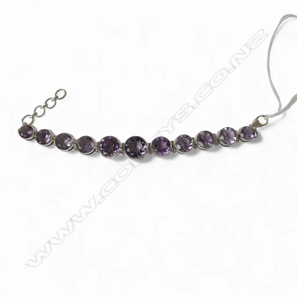 SILVER & AMETHYST BRACELET; STONES ARE GRADUATED Image 1++